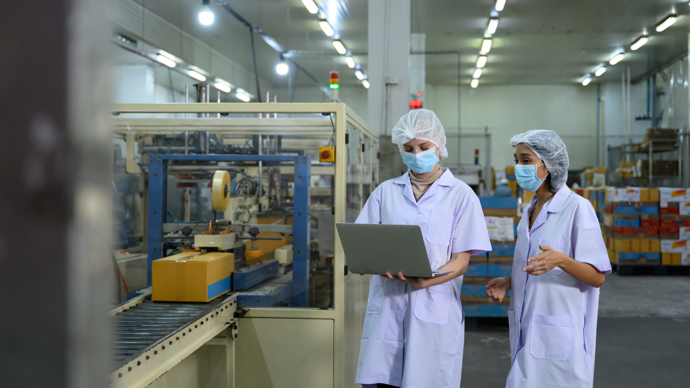 quality-control-inspections-vietnam Vietnam quality control inspectors conducting a factory inspection, checking product quality and manufacturing standards on the production line.